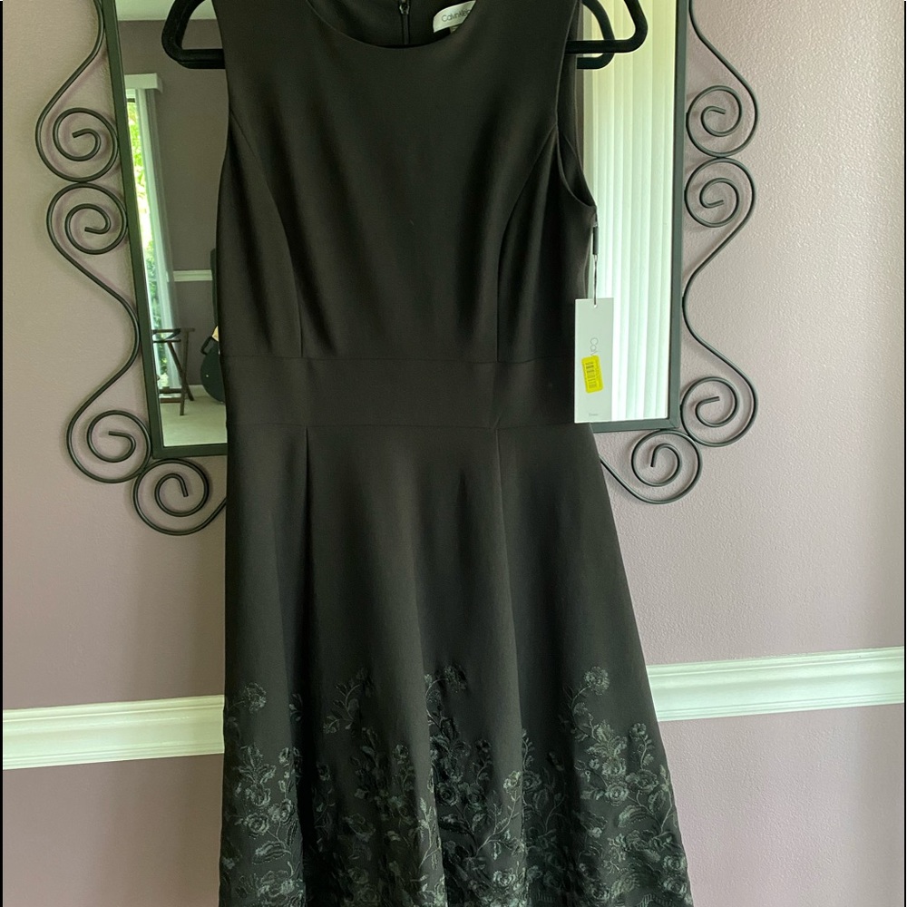 Black dress with embroidered bottom.